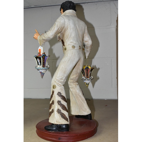 569 - A COMPOSITE FIGURE OF ELVIS PRESLEY WITH TWO HANGING ELVIS ORNAMENTS, the figure depicting Elvis per... 