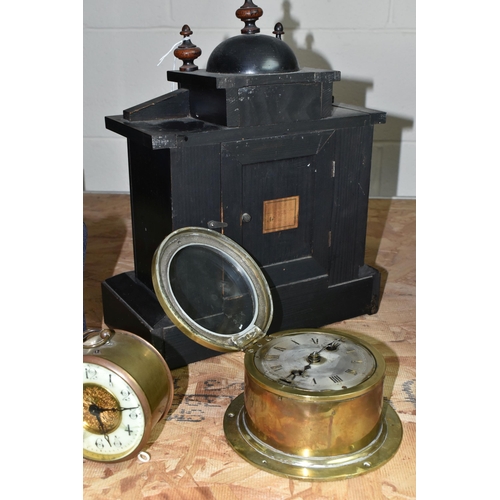 578 - A GROUP OF CLOCKS, comprising a late nineteenth century black wooden cased mantel clock, a brass bin... 