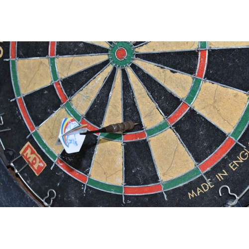 591 - A MY OFFICIAL COMPETITION DART BOARD HOUSED IN A DOUBLE DOOR CABINET, the inside of the doors painte... 