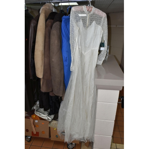 613 - FOUR BOXES, THREE SUITCASES AND LOOSE VINTAGE CLOTHING, to include two men's vintage sheepskin coats... 