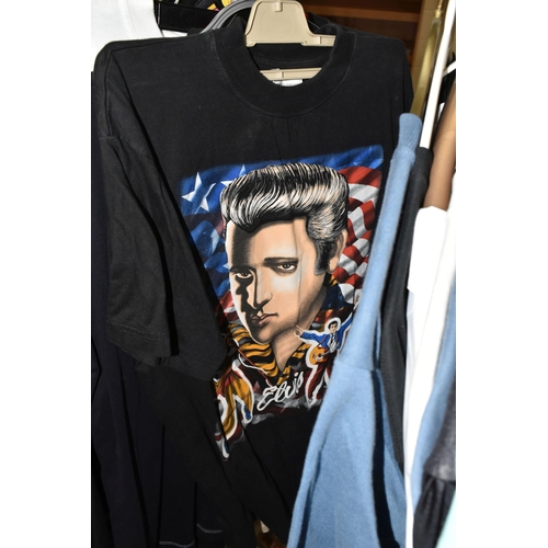 616 - A LARGE QUANTITY OF LOOSE GENTLEMENS CLOTHING, a quantity of Elvis themed T-shirts and jackets to in... 