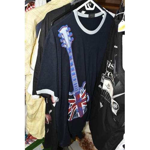 616 - A LARGE QUANTITY OF LOOSE GENTLEMENS CLOTHING, a quantity of Elvis themed T-shirts and jackets to in... 