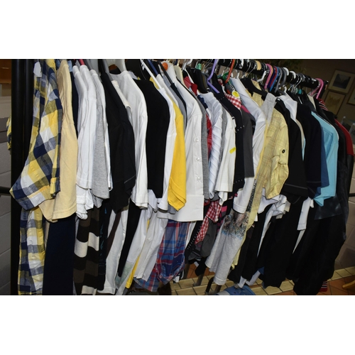 616 - A LARGE QUANTITY OF LOOSE GENTLEMENS CLOTHING, a quantity of Elvis themed T-shirts and jackets to in... 