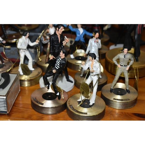 355 - A COLLECTION OF MUSICAL 'ELVIS' FIGURINES, comprising four Franklin Mint music box figures, 'Burning... 