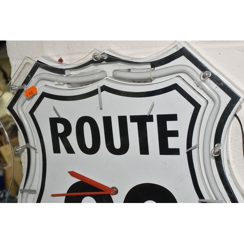 464 - A 'ROUTE 66' NEON ILLUMINATED WALL CLOCK, shield shape, with clear Perspex front marked with dashes ... 