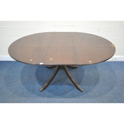 1214 - A 20TH CENTURY MAHOGANY EXTENDING DINING TABLE, with a single fold out leaf, raised on four splayed ... 