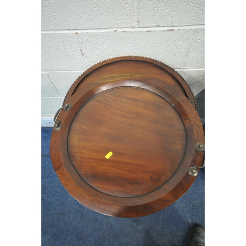 1216 - A REPRODUCTION MAHOGANY OVAL DRINKS CABINET, with a removable tray, bevelled glass panes and a singl... 