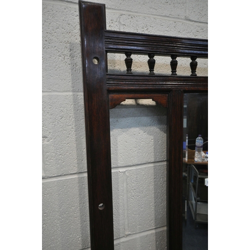 1219 - AN EARLY 20TH CENTURY OAK HALL STAND, with a central rectangular bevelled edge mirror, a hinged stor... 