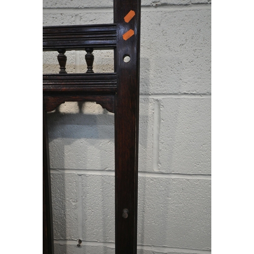 1219 - AN EARLY 20TH CENTURY OAK HALL STAND, with a central rectangular bevelled edge mirror, a hinged stor... 