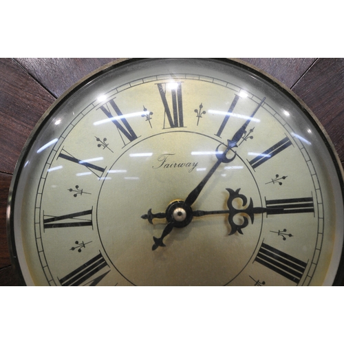 1223 - A LATE 20TH CENTURY TEAK STARBURST WALL CLOCK, with Roman numerals, signed Fairway to face, diameter... 