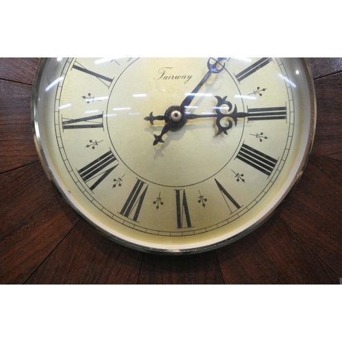 1223 - A LATE 20TH CENTURY TEAK STARBURST WALL CLOCK, with Roman numerals, signed Fairway to face, diameter... 