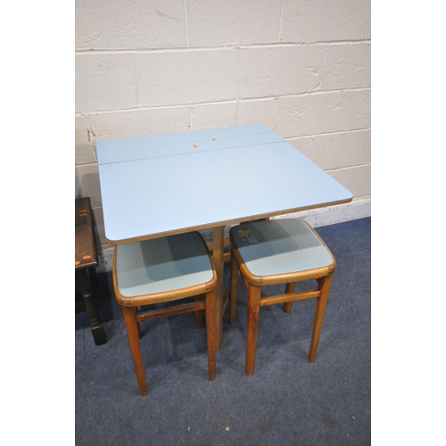 1246 - A MID CENTURY PALE BLUE FORMICA TOP GATE LEG TABLE, and two stools, along with an oak coffee table a... 