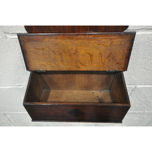 1247 - AN OAK WALL MOUNTED SPOON RACK, in the Georgian style, likely to be late 19th century, with a lidded... 