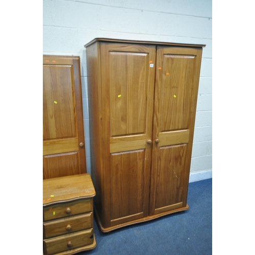 1251 - A MODERN PINE BEDROOM SUITE, comprising a triple door wardrobe (dismantled) a two door wardrobe, wid... 