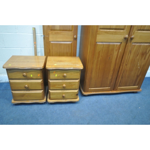 1251 - A MODERN PINE BEDROOM SUITE, comprising a triple door wardrobe (dismantled) a two door wardrobe, wid... 