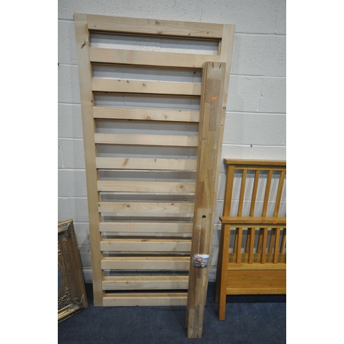 1287 - A SOLID OAK SUPER KING BEDSTEAD, with siderails, slats, and supports (condition report: general sign... 