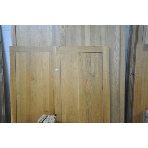 1329 - A SOLID OAK PANELLED DOUBLE DOOR WARDROBE, with a single drawer, width 109cm x depth 60cm x height 1... 