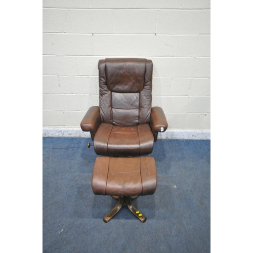 1336 - A BROWN LEATHER SWIVEL RECLINING ARMCHAIR, width 87cm x depth 83cm x height 105cm, along with a foot... 