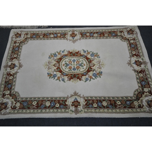 1342 - FOR RECTANGULAR CHINESE RUGS, three pink ones and one white one, largest 181cm x 122cm (condition re... 