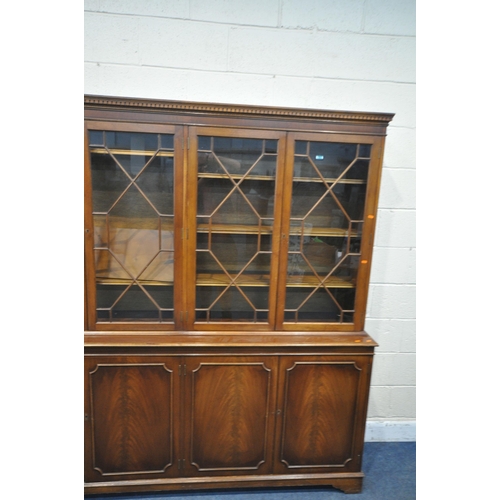 1344 - A LATE 20TH CENTURY MAHOGANY WALL CABINET, with four astragal glazed doors, atop a base with four cu... 