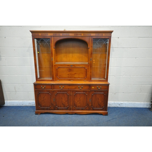 1344 - A LATE 20TH CENTURY MAHOGANY WALL CABINET, with four astragal glazed doors, atop a base with four cu... 