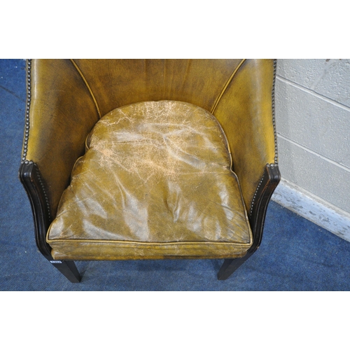 1354 - A MUSTARD LEATHER TUB CHAIR, width 65cm x depth 68cm x height 83cm (condition report: cushion worn a... 