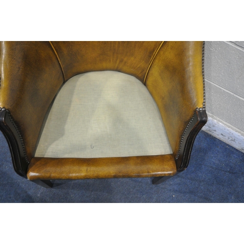 1354 - A MUSTARD LEATHER TUB CHAIR, width 65cm x depth 68cm x height 83cm (condition report: cushion worn a... 