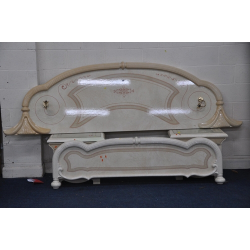 1362 - AN ITALIAN CREAM FINISH BEDSTEAD, with a shaped headboard that has a pair of lamp, flanked by two dr... 