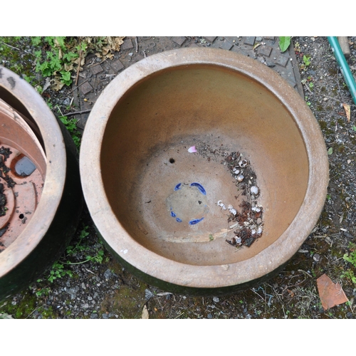 1006 - A PAIR OF GREEN GLAZED PLANTERS, diameter 53cm x height 33cm (condition report: slightly weathered) ... 