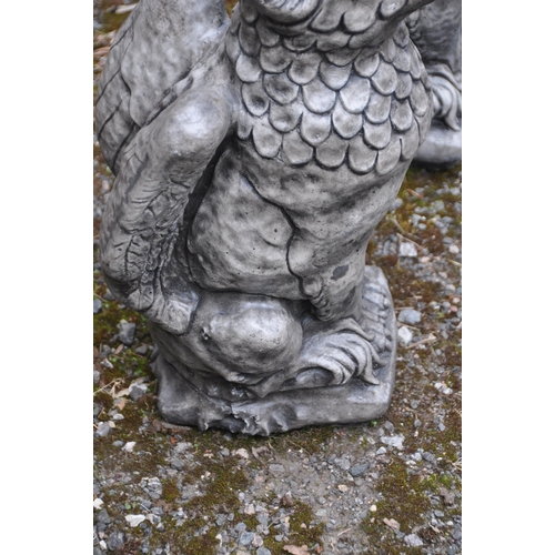 1008 - A PAIR OF COMPOSITE GARDEN FIGURES, of seated griffins, height 55cm (condition report: overall good ... 