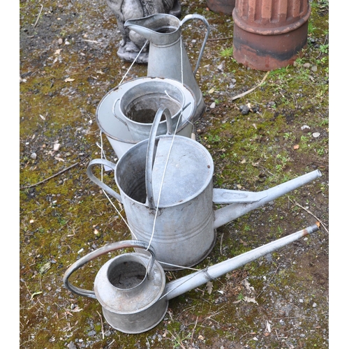 1009 - A SELECTION OF GALVANISED GARDENING ITEMS, to include two watering cans, a pale, and a slim cylindri... 