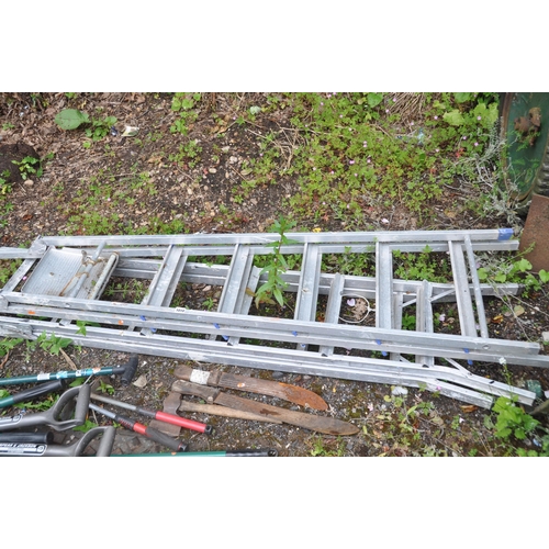 1010 - TWO ALUMINIUM STEP LADDERS, along with a quantity of gardening tools, to include a fork, shovel, axe... 