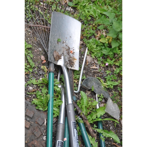 1010 - TWO ALUMINIUM STEP LADDERS, along with a quantity of gardening tools, to include a fork, shovel, axe... 