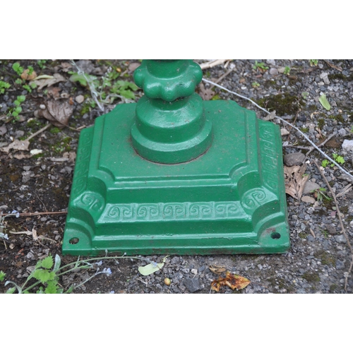 1014 - A GREEN PAINTED CAST IRON LETTER BOX, the door depicting a horse and jockey, raised on a cylindrical... 