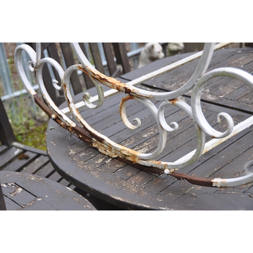 1019 - A METAL TWO SEATER GARDEN ROCKING CHAIR, with scrolled crests and armrests, length 110cm (condition ... 