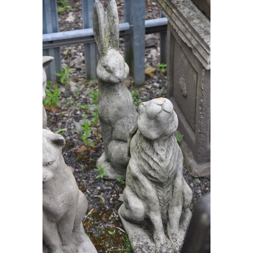 1022 - FOUR COMPOSITE GARDEN FIGURES, two cats and two hares, tallest height 50cm (condition report: slight... 