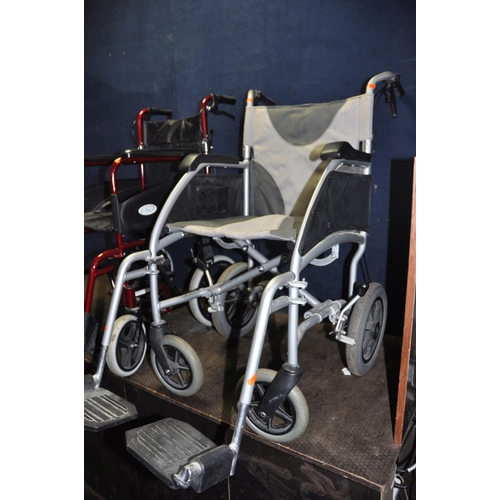 1052 - TWO FOLDING WHEELCHAIRS one by Drive Medical and the other by Z-Tec both with two footrests ( Condit... 