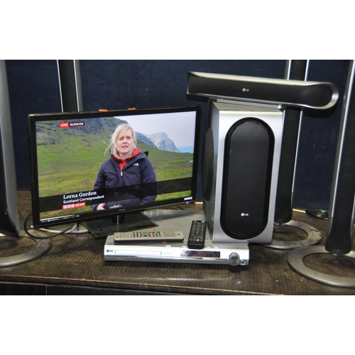 1056 - A TECHNIKA 23.6in TV WITH REMOTE and a LG Home cinema System with DVD controller, remote, four tower... 