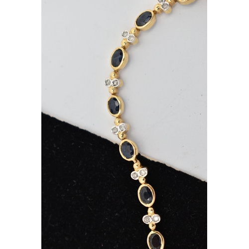 1 - A YELLOW METAL DIAMOND AND SAPPHIRE BRACELET, comprised of eighteen oval cut sapphires in a bezel se... 