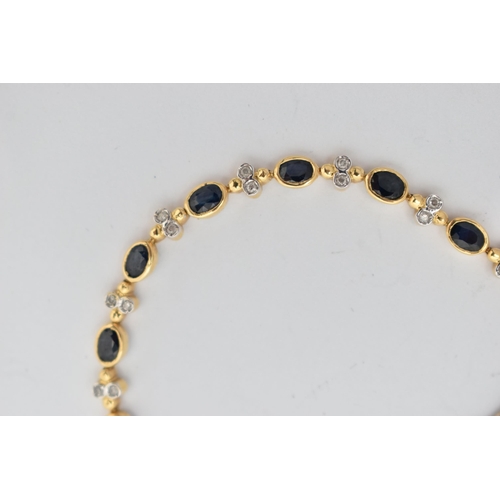 1 - A YELLOW METAL DIAMOND AND SAPPHIRE BRACELET, comprised of eighteen oval cut sapphires in a bezel se... 