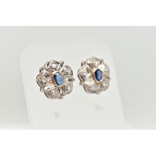 31 - A PAIR OF SAPPHIRE AND DIAMOND STUD EARRINGS, each designed as a scalloped panel with a central oval... 