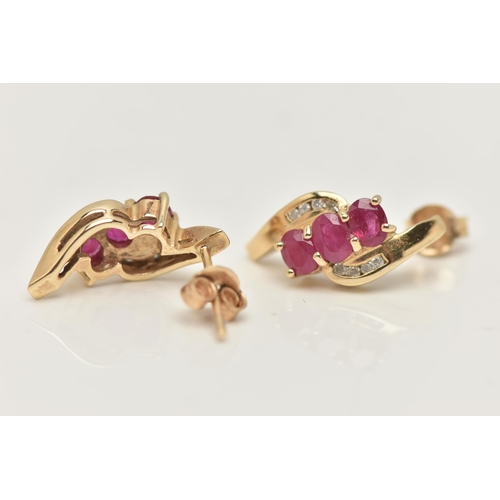 39 - A PAIR OF 9CT GOLD RUBY AND DIAMOND EARRINGS, each designed as a diagonal row of three oval rubies w... 