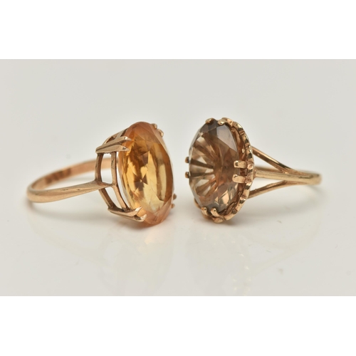 4 - TWO 9CT GOLD GEM SET RINGS, the first an oval cut citrine, prong set in yellow gold, approximate sto... 