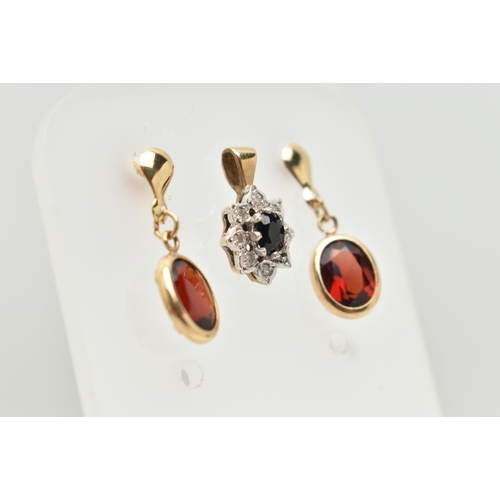 48 - A 9CT GOLD CLUSTER PENDANT AND A PAIR OF YELLOW METAL GARNET DROP EARRINGS, the oval cluster set wit... 