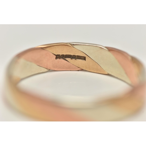 5 - A 9CT GOLD TRI COLOUR BAND RING, a twisted design of white, yellow and rose gold, approximate band w... 