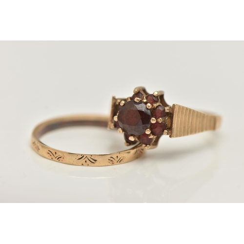 69 - TWO 9CT GOLD RINGS, the first a raised circular garnet cluster ring, textured shoulders leading onto... 