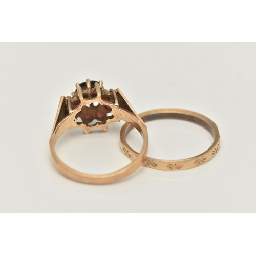 69 - TWO 9CT GOLD RINGS, the first a raised circular garnet cluster ring, textured shoulders leading onto... 