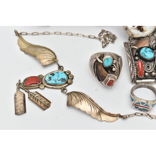 74 - WHITE METAL NAVAJO JEWELLERY, to include a cuff bangle set with coral, turquoise and a central bear ... 