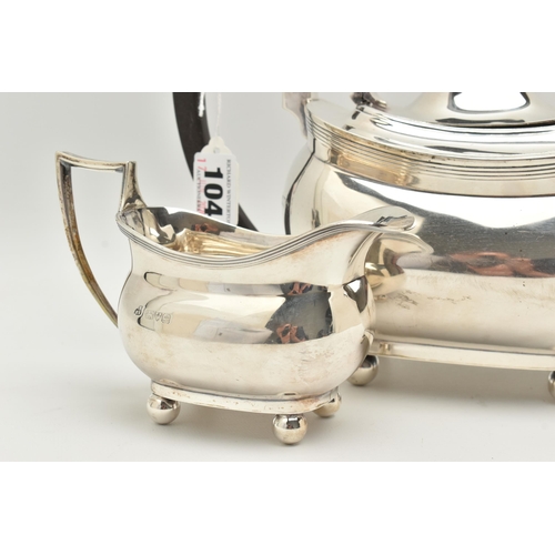 104 - A GEORGE V SILVER THREE PIECE TEA SET, comprising of a teapot, milk jug and double handled sugar bow... 