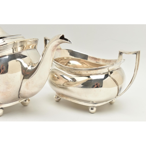 104 - A GEORGE V SILVER THREE PIECE TEA SET, comprising of a teapot, milk jug and double handled sugar bow... 